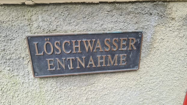 Metal sign with inscription in German - fire water extraction point