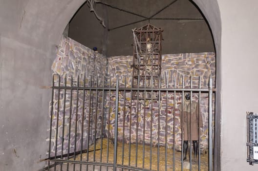 Medieval torture chamber with rats and skull.