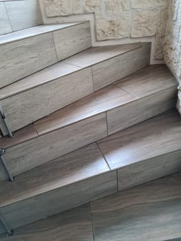 Empty stairway with tiled floor. No entry sign.
