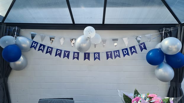 Celebration banner. Happy birthday party background with golden ribbons, confetti and balloons. Realistic anniversary