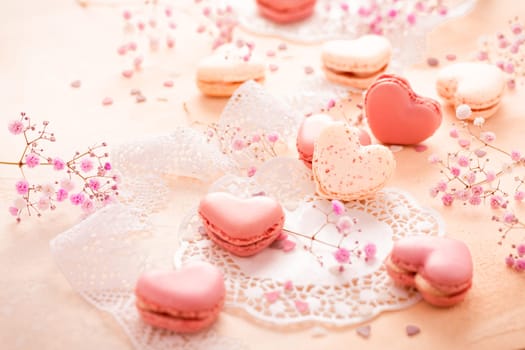 Happy Mothers Day - sweet macarons in heart shape with flowers in pink tone