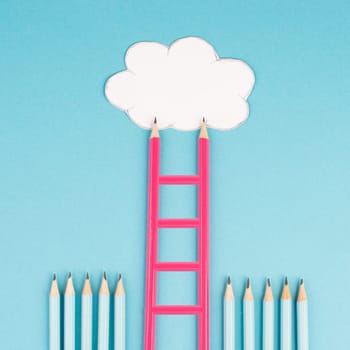Ladder of success build with pencils, opportunity strategy, blue background, copy space for text, step by step concept, progress in business and education, have a goal