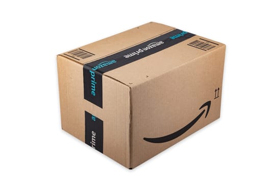 WETZLAR, GERMANY 2022-04-25: Amazon Prime parcel over white background. Prime is a service offered by online retailer Amazon for faster delivery of orders.