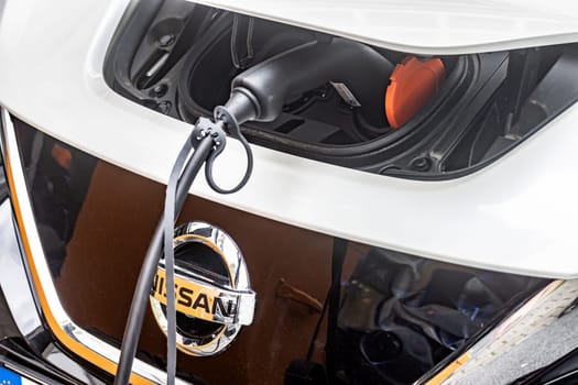 WETZLAR, GERMANY 2022-04-23: A NIssan's electric car is being charged. Nissan is a Japanese multinational automobile manufacturer.
