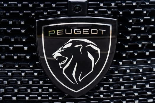 WETZLAR, GERMANY 2022-04-23: Peugeot logo closeup on a car grill. Peugeot as car manufacturer was founded at 1882.