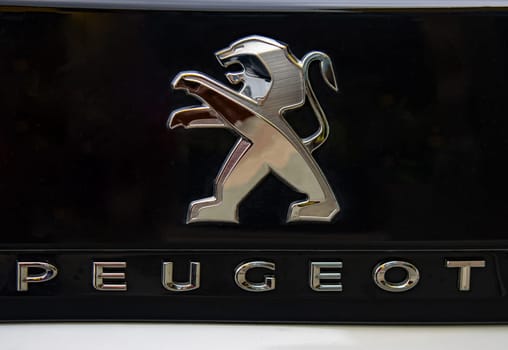 WETZLAR, GERMANY 2022-04-23: Peugeot logo closeup on a car grill. Peugeot as car manufacturer was founded at 1882.