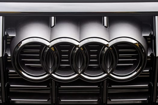 WETZLAR, GERMANY 2022-04-23: Close-up of Audi logo on a Car. Audi AG is a German automobile manufacturer that designs, engineers, produces, markets and distributes luxury vehicles.