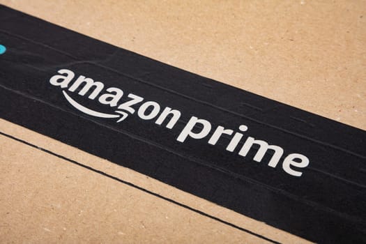 WETZLAR, GERMANY 2022-04-25: Amazon Prime shipping box with branded tape on it. Amazon is an American electronic commerce and cloud computing company.