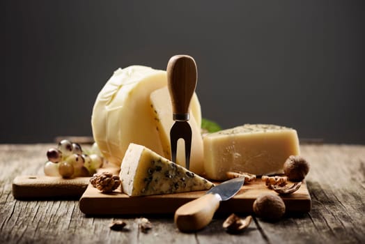Cheese and grape on wooden table