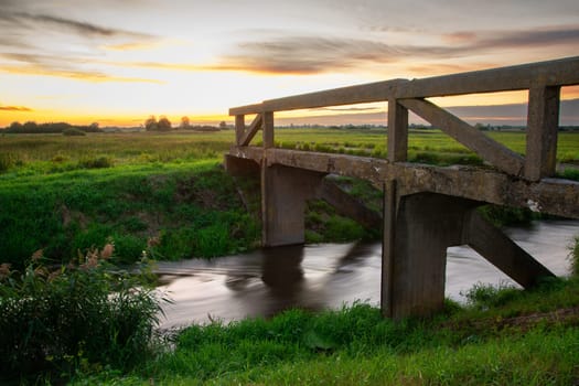 Bridge over the Uherka river and sunset, Czulczyce, Poland