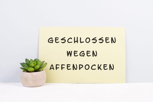 The words closed due to monkeypox are standing on a sign, german language, outbreak of the MPXV virus pandemic, infectious disease spreading