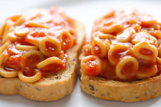 close up of english aussie pasta hoops in tomato sauce toast comfort food