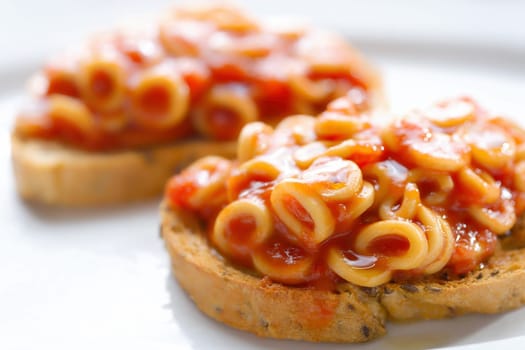 close up of english aussie pasta hoops in tomato sauce toast comfort food