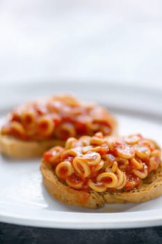 close up of english aussie pasta hoops in tomato sauce toast comfort food