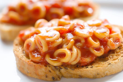 close up of english aussie pasta hoops in tomato sauce toast comfort food