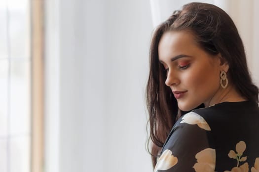 Portrait of attractive dark haired girl. Horizontally.
