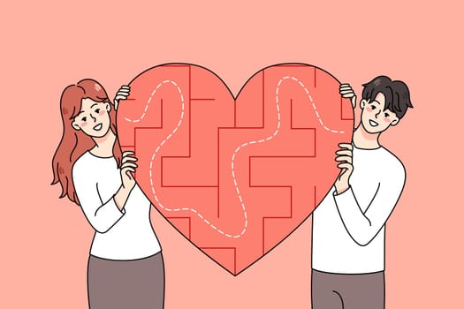 Happy young couple with heart symbol with labyrinth inside search love. Smiling man and woman look for relationships. Dating application and service. Flat vector illustration.