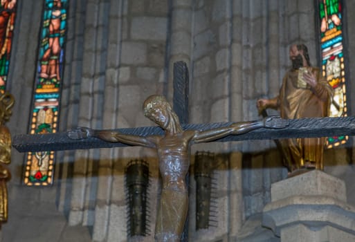 Plasencia, Spain - May 21h, 2022: Medieval Christ on the Cross at Saint Nicholas Church, Plasencia Old town, Caceres, Extremadura, Spain