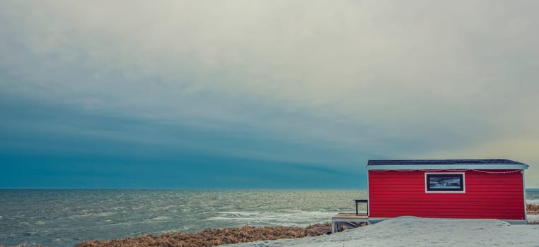 The lonely red house on the sea in kamchatka Peninsula