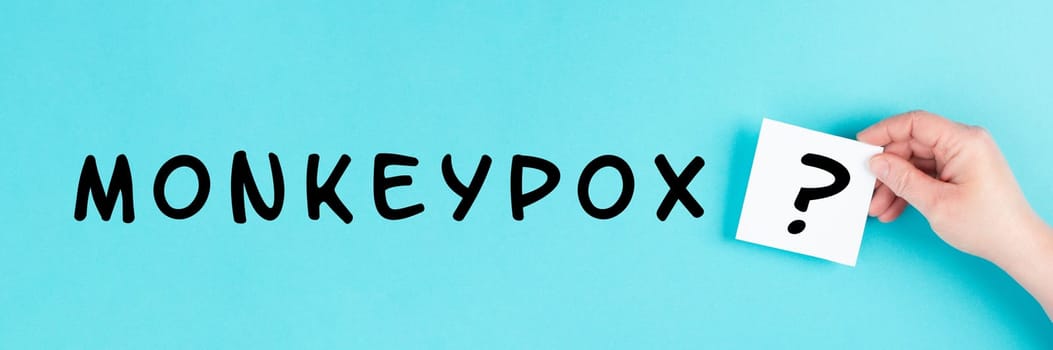 The word monkeypox is standing on a paper, outbreak of the MPXV virus, infectious disease spreading