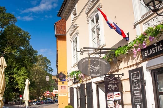 SAMOBOR, CROATIA-May 22, 2022: The City center of Samobor, with its church in the background, is a tourist attraction because of a ruined castle on a nearby hill.