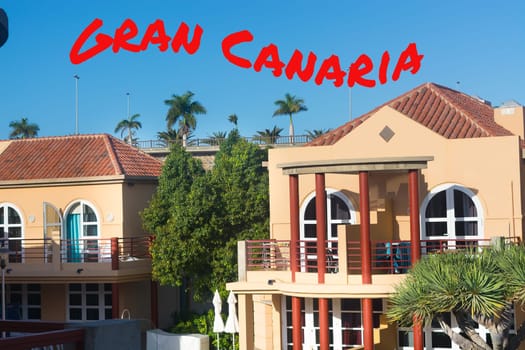 View of holiday apartment complex with swimming pool in Meloneras, Gran Canaria in Spain.
