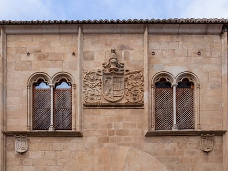 Beautiful mullioned windows at Palace of Mayoralgo. Caceres, Extremadura, Spain