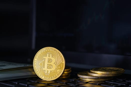 Bitcoin coin on keyboard computer. Bitcoin crypto currency coin with trading exchange market price
