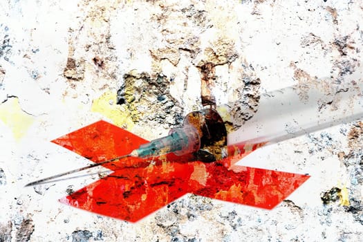 Syringe and red cross