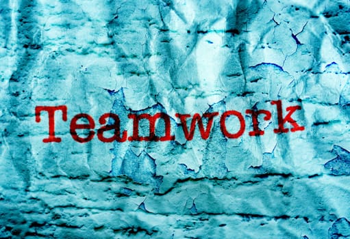 Teamwork text on grunge background
