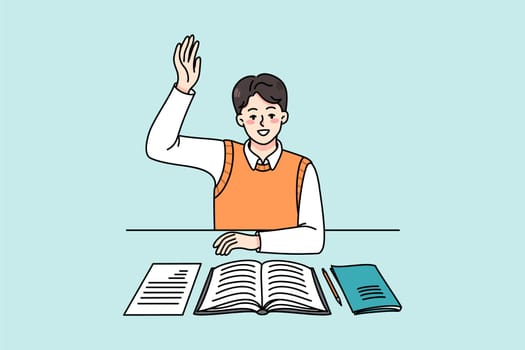 Active schoolboy sitting at desk in class raise hand volunteer to answer. Smart boy child participate in discussion at lesson. Clever kid at class. Education concept. Vector illustration.