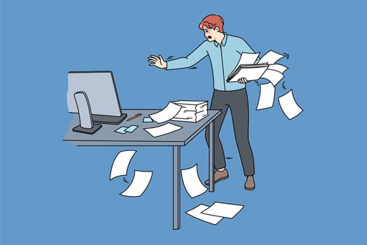Clumsy employee collect scattered paperwork in office. Awkward tired male worker manage paper documents at workplace. Mess and chaos at work. Flat vector illustration.