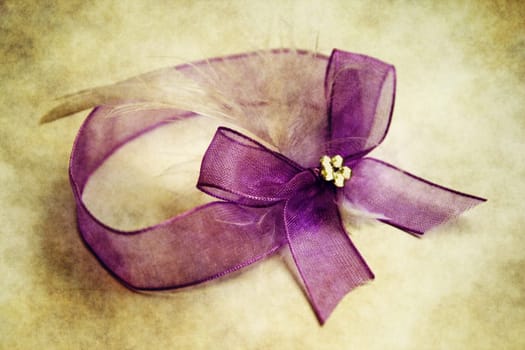 Purple ribbon on grunge background