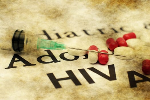 Syringe on aids text
