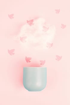 Cup of coffee with a steam cloud, birds flying to the sky, pastel colors, brainstorming for ideas, mindset of freedom, creative business idea, optimistic future, taking a break