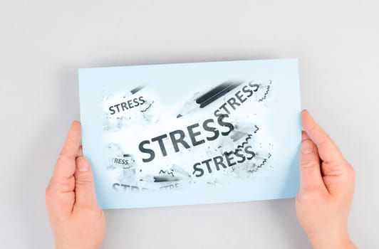 The word stress is standing on a paper, pen with eraser, burnout concept, work life balance, breakdown by exhaustion