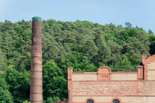 a old industrial building with chimney