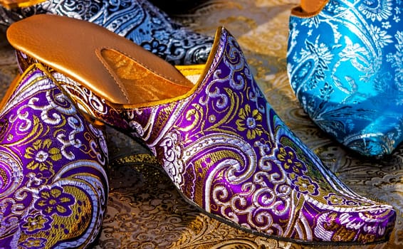Women`s sandal close up with a design made of openwork fabric.
