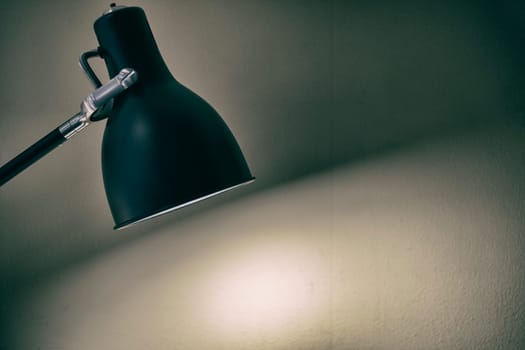 Black fixture lamp with white  wall background