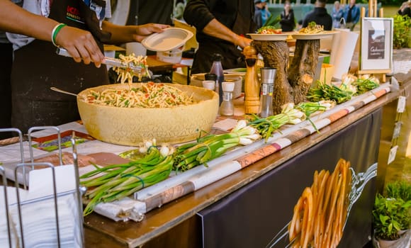 Hockenheim, Germany - May 28, 2022: Street food festival, preparing pasta at food truck