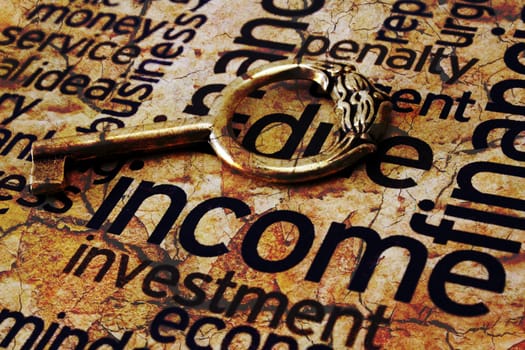 Golden key on income text