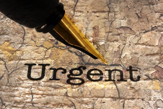 Fountain pen on urgent text