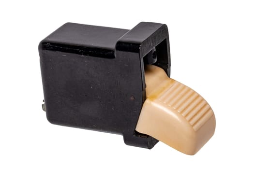 Old car parts. Close-up of an ivory-coloured fluted electric switch buttom with four connections for the car interior. Clipping path. GDR vehicle electrics around 1960 isolated.