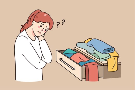 Confused girl look at open drawer with clothes have nothing to wear. Unhappy young woman looking at apparel, have clothing problem. Shopaholic and garment issues. Vector illustration.
