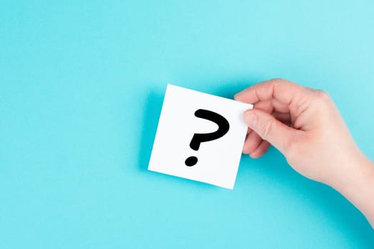 Question mark in the hand, looking for an answer, searching for knowledge, problem solving, business and education concept