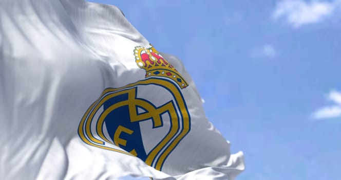 Madrid, Spain, May 2022: The flag of Real Madrid Club de Fútbol waving in the wind on a clear day. Real Madrid C.F. is a Spanish professional football club based in Madrid