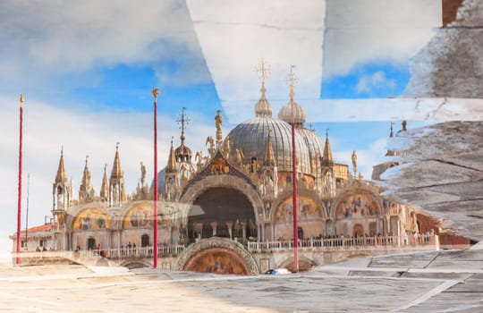 Water reflection view of St Mark's Basilica, Venice, Italy.