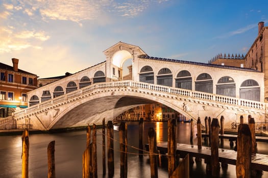 The Rialto Bridge at sunrise, one of the most visited sights of Venice, Italy.