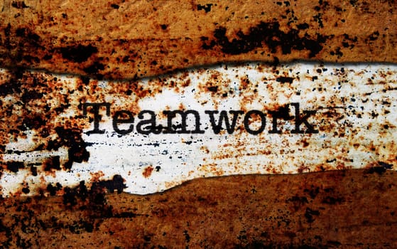 Teamwork on torn paper