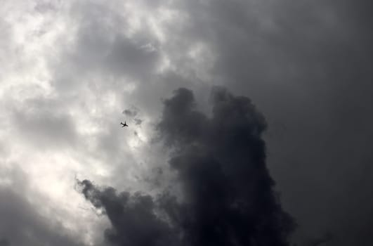 A passenger plane flies into a thundercloud